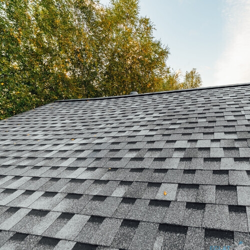 new renovated roof covered with shingles flat polymeric roof-tiles