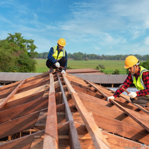 Roofer, Two worker roofer builder working on roof structure on construction site, Teamwork construction concept.