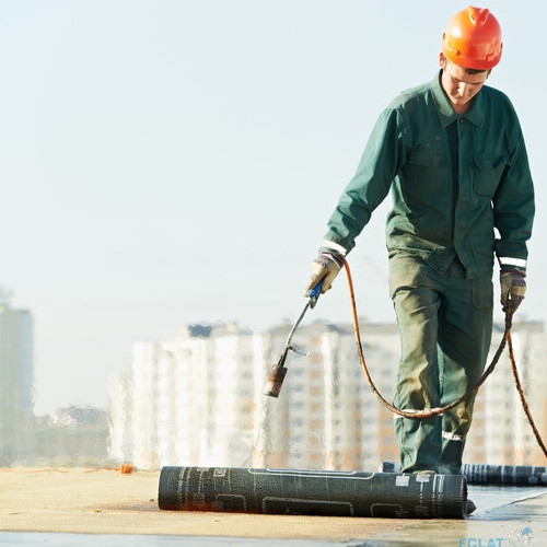 Flat roof covering repair works with roofing felt