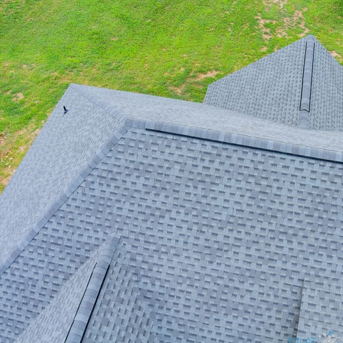 Roofing construction house rooftops covered with asphalt shingles an aerial view