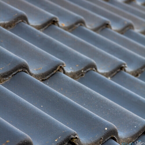 A selective closeup of gray roof tiles