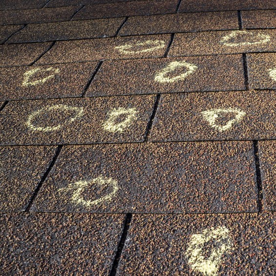 chalk circles indicating hail damage