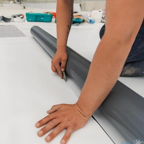 workers installing TPO roofing