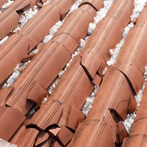 close up of hail damaged clay roof 