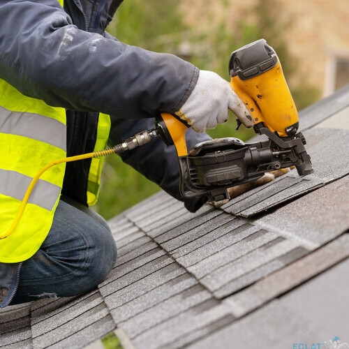 worker installing a roofing system
