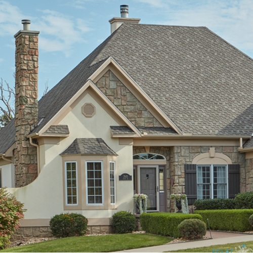 upscale home with a high-quality shingle roof